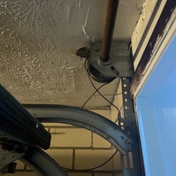 Above & Beyond Door Systems - Left side cable detaching from pulley