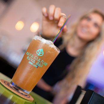 Kava Culture Kava Bar - a woman holding a drink - Lounges Near Me - Estero, Florida Kava Culture Kava Bar - a woman holding a drink - Lounges Near Me - Estero, Florida
