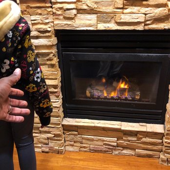 Moonstone Landing - Bernie Lawrence Jr. and Victoria Lawrence enjoying the fireplace in the Ocean View Suite! - Hotels Near Me - Cambria, California