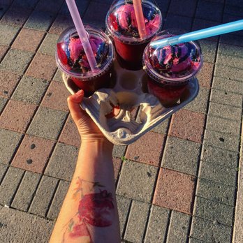 Marouf Tochal - a person holding a tray of drinks - Juice Bars & Smoothies Near Me - Vaughan, Ontario