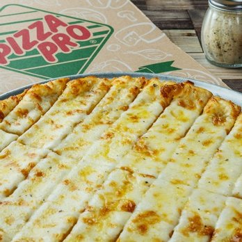 Pizza Pro Lake Palestine - a cheese pizza on a pan - Pizza Near Me - Chandler, Texas Pizza Pro Lake Palestine - a cheese pizza on a pan - Pizza Near Me - Chandler, Texas