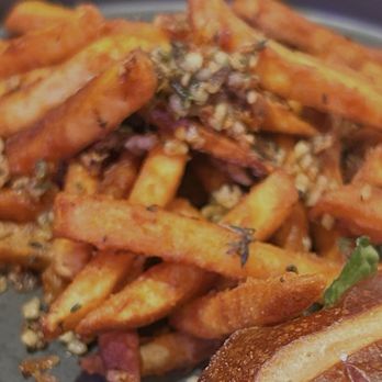 Wolfhounds Bar & Grill - Close up of how over cooked the garlic thyme fries were. - Sports Bars Near Me - Salem, Oregon Wolfhounds Bar & Grill - Close up of how over cooked the garlic thyme fries were. - Sports Bars Near Me - Salem, Oregon