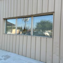 Handy Firefighter Construction - Window at Roseville Elk's Lodge customer wanted it cut out and framed for a door.