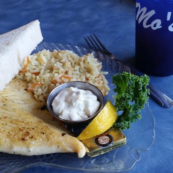 Mo's Seafood & Chowder - Grilled halibut with rice pilaf and the giant unecessary bread slice. - Seafood Near Me - Cannon Beach, Oregon Mo's Seafood & Chowder - Grilled halibut with rice pilaf and the giant unecessary bread slice. - Seafood Near Me - Cannon Beach, Oregon