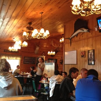 Garrett's Place - people sitting at tables in a restaurant - Breakfast & Brunch Near Me - Houghton Lake, Michigan