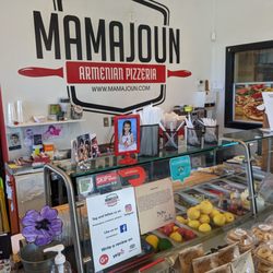 Mamajoun Armenian Pizzeria - Logo and fresh toppings