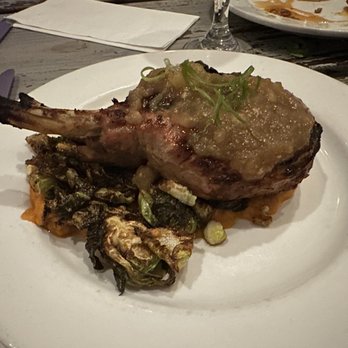 Millie's Restaurant and Catering - DOUBLE BONE PORK CHOP - Confit & grilled, sweet potato puree, miso apple butter, fried brussels - American Near Me - Daytona Beach, Florida Millie's Restaurant and Catering - DOUBLE BONE PORK CHOP - Confit & grilled, sweet potato puree, miso apple butter, fried brussels - American Near Me - Daytona Beach, Florida