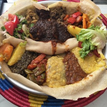 Restaurant Godjo - One side is the vegetarian sampler and the other is the meat for my husband! - Ethiopian Near Me - Paris, 75 Restaurant Godjo - One side is the vegetarian sampler and the other is the meat for my husband! - Ethiopian Near Me - Paris, 75