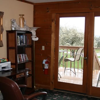 Deer Harbor Inn - Part of the lower common area, including several bookshelves, DVD shelf, computer with internet, and more games. - Hotels Near Me - Deer Harbor, Washington