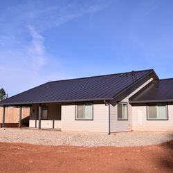 Atlas Building Solutions - Standing Seam Metal Roofing, New Skylight, Seamless Gutters, and Gutter Guards installed by Atlas Building Solutions in Paradise, CA.