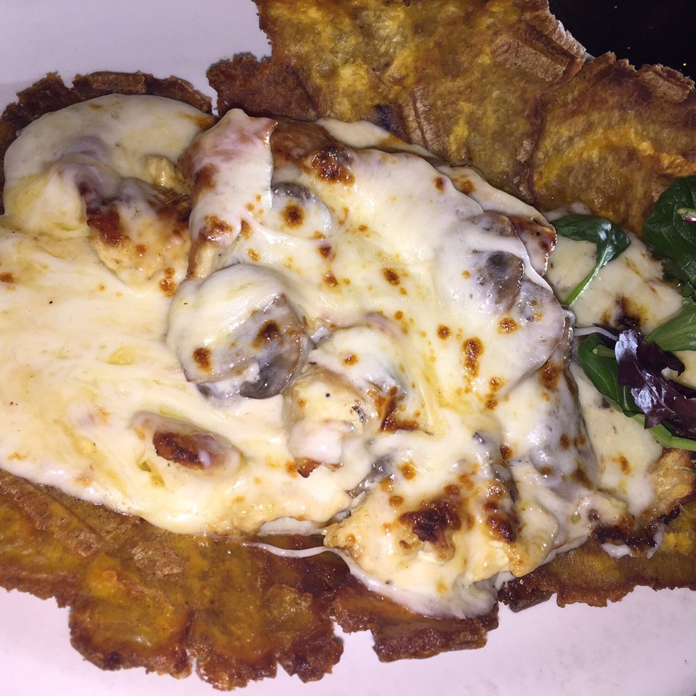 Patacon Pisa'o - Kendall - Chicken and cheese Patacón with mushroom sauce - Colombian Near Me - Miami, Florida Patacon Pisa'o - Kendall - Chicken and cheese Patacón with mushroom sauce - Colombian Near Me - Miami, Florida