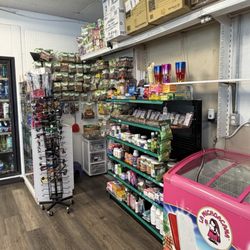 Snacks, vitamins, and spices for sale in the corner.