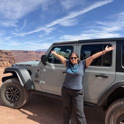 Canyonlands Jeep and Car Rentals - Looking slick next to our Jeep rental along Shafer Trail.
