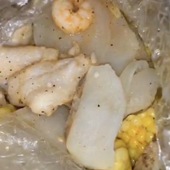 Longwood Fish Corp - Basa fillet, shrimp, corn and potatoes in spicy seasoning with lots of garlic and butter - Seafood Near Me - Brooklyn, New York