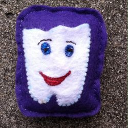 A Tooth Fairy Pillow I made by hand.   The white tooth part is the pocket.