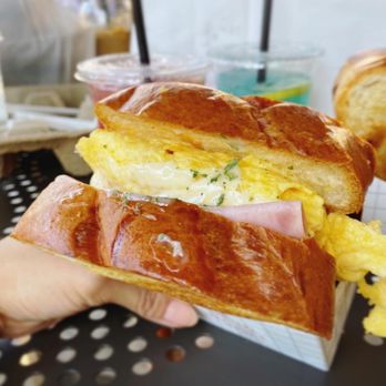 Flippoly - a person holding a sandwich in their hand - Sandwiches Near Me - Irvine, California Flippoly - a person holding a sandwich in their hand - Sandwiches Near Me - Irvine, California