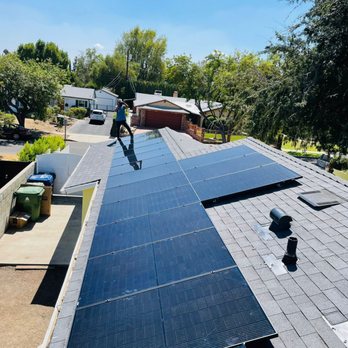 Sunrise Energy Group - a man installing solar panels on a roof - Solar Installation Near Me - Los Angeles, California Sunrise Energy Group - a man installing solar panels on a roof - Solar Installation Near Me - Los Angeles, California