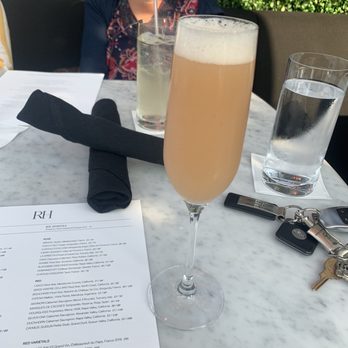 RH Rooftop Restaurant at RH Dallas - Peach mimosa - American Near Me - Dallas, Texas RH Rooftop Restaurant at RH Dallas - Peach mimosa - American Near Me - Dallas, Texas