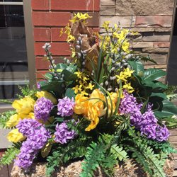 Tim Hortons - Spring has finally sprung Yes, believe it or not! But this TH went with silk flowers. Crowned ... with a bag of TH garbage.