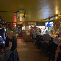 The Englewood Tavern - This is the view when you enter. Bar on the right, music room to the left and bathrooms and patio at the far end.