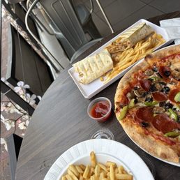 Build your own pizza, fries, and chicken shawarma . Build your own pizza, fries, and chicken shawarma .