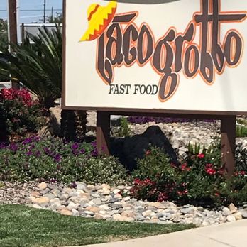 Taco Grotto - a sign for a fast food restaurant - Mexican Near Me - DOS Palos, California Taco Grotto - a sign for a fast food restaurant - Mexican Near Me - DOS Palos, California