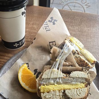 Eltana - The chicken sausage sandwich on an everything bagel, with a Qishir latte. - Coffee & Tea Near Me - Seattle, Washington Eltana - The chicken sausage sandwich on an everything bagel, with a Qishir latte. - Coffee & Tea Near Me - Seattle, Washington
