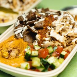 Yafa Hummus - White rice bowl with chicken shawarma, gyro, spicy hummus, Mediterranean salad. dressed with chili sauce and garlic.