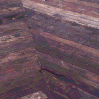 Upstate Contractors - a large pile of wood with a broom on top of it - Roofing Near Me - Syracuse, New York Upstate Contractors - a large pile of wood with a broom on top of it - Roofing Near Me - Syracuse, New York