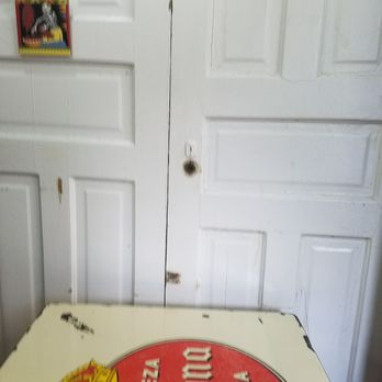 Flaco's Tacos - A table and doors that are hung on the wall as decorations. - Mexican Near Me - Chicago, Illinois Flaco's Tacos - A table and doors that are hung on the wall as decorations. - Mexican Near Me - Chicago, Illinois