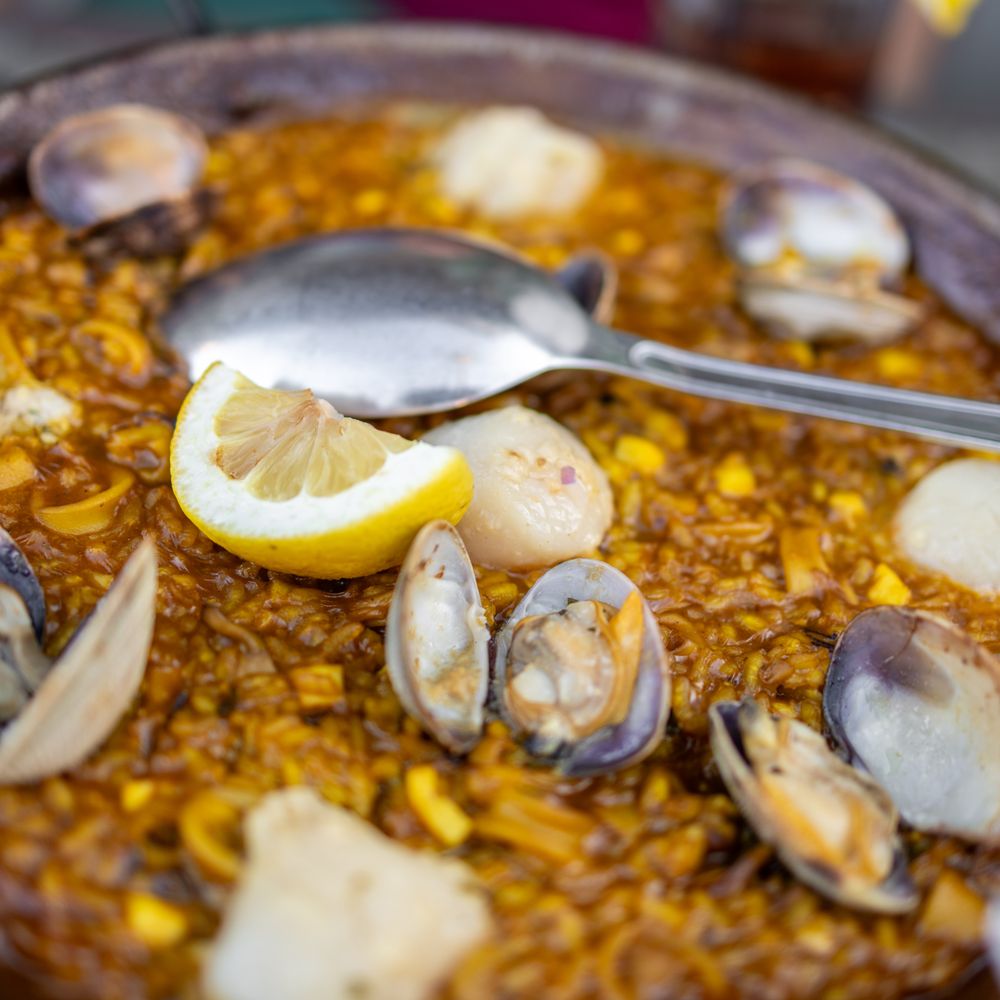 Puerta del Sol - Paella de Mariscos ($44) rich shrimp broth, bomba rice & nora sofrito. Topped with shrimp, monkfish, clam & squid - Tapas/Small Plates Near Me - San Jose, California Puerta del Sol - Paella de Mariscos ($44) rich shrimp broth, bomba rice & nora sofrito. Topped with shrimp, monkfish, clam & squid - Tapas/Small Plates Near Me - San Jose, California