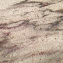 Stone Source installers tried to tell me this was a natural variation in the stone, and not a repair, until I pointed out glob of resin Stone Source installers tried to tell me this was a natural variation in the stone, and not a repair, until I pointed out glob of resin