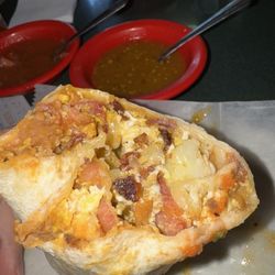 Breakfast Burrito: Eggs, beans, cheese, bacon, potatoes.
