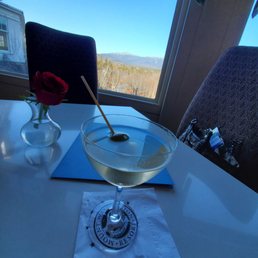a glass of wine and a napkin on a table