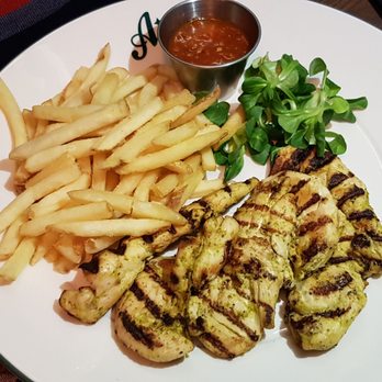 All Star Lanes - Chargrilled chicken tenders marinated in coriander, parsley and chilli, served with pepper pot hot dipping sauce and skinny fries. - Bars Near Me - London, XGL