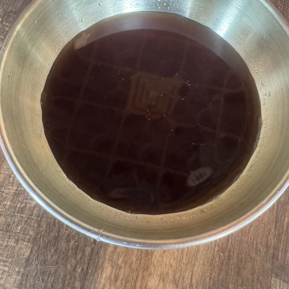 Katana Cocina Nikkei - Nice presentation of the eel sauce in a gold saucer. - Japanese Near Me - Weston, Florida