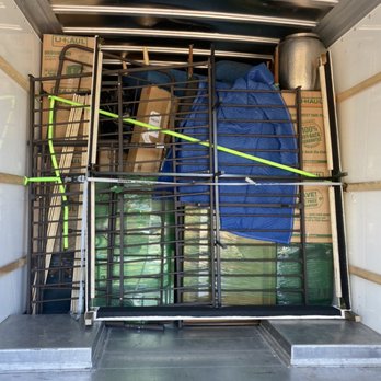 Key Moving & Transport - Building a solid wall to lock everything in place - Movers Near Me