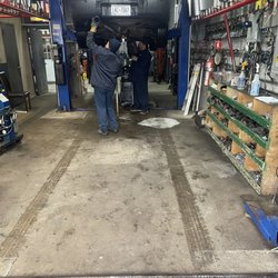 King Muffler - The guys hooking up the exhaust