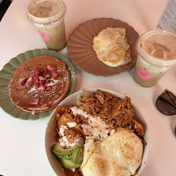 Cafecito - chilaquiles with tinga and a single pink pancake with lechera and strawberries - Mexican Near Me - Fort Worth, Texas Cafecito - chilaquiles with tinga and a single pink pancake with lechera and strawberries - Mexican Near Me - Fort Worth, Texas