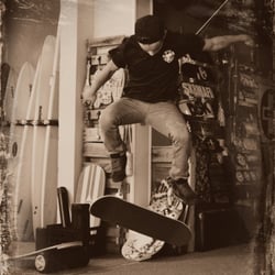 Zeke's Surf, Skate And Paddle Sports - Miles - our team rider for the skateboard division - showing off his moves inside the shop