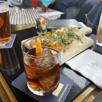 The Skylark - Maple Walnut Old Fashioned, $19 (elijah craig small batch bourbon, maple syrup, walnut bitters & candied walnuts), Pear & Rosemary Collins - Cocktail Bars Near Me - New York, New York
