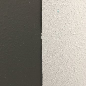 Dan's Painting Service - Bad workmanship on accent wall, paint bleeding over to adjacent wall. - Painters Near Me Dan's Painting Service - Bad workmanship on accent wall, paint bleeding over to adjacent wall. - Painters Near Me