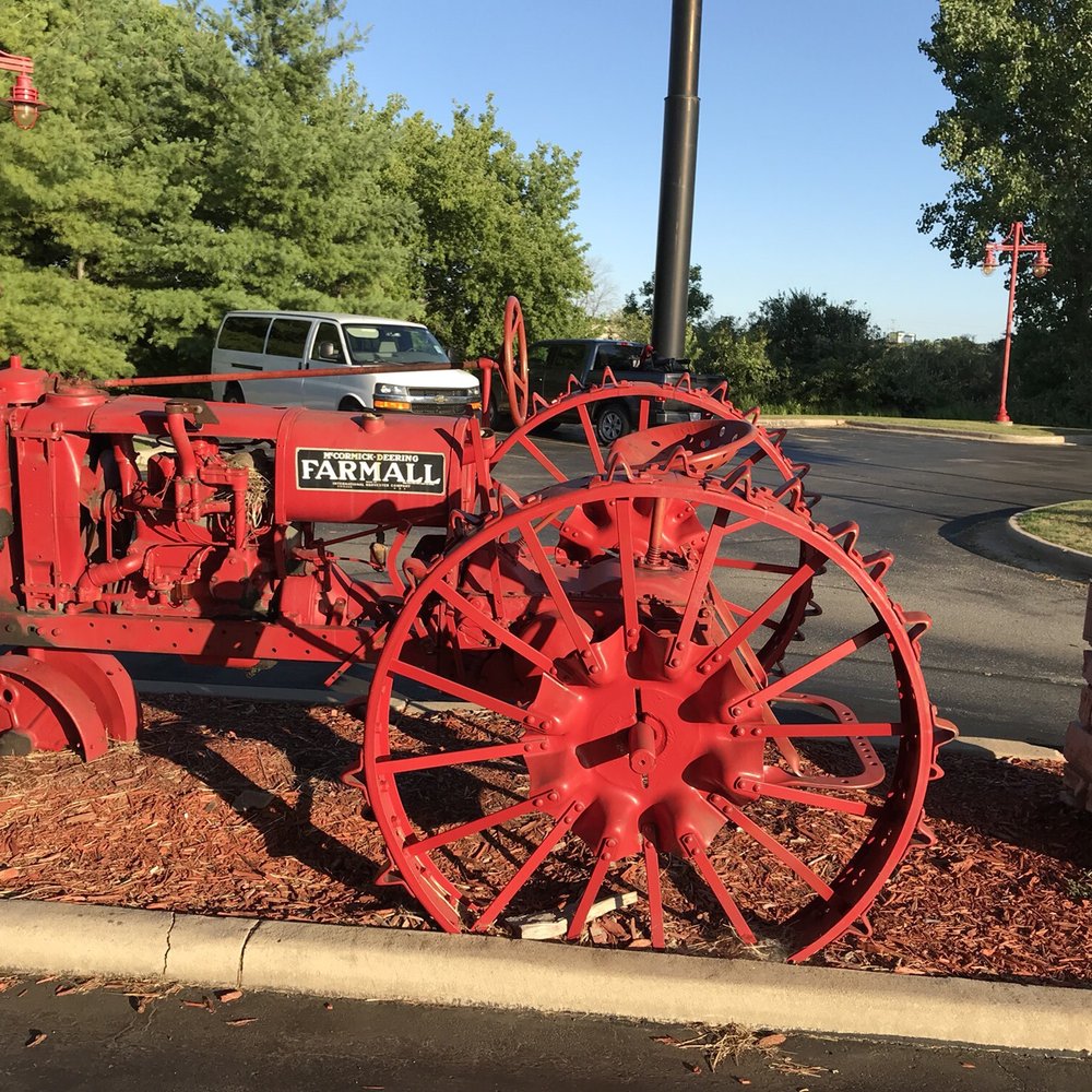 Machine Shed Restaurant - Old Farmall Tractor at Entrance - American Near Me - Appleton, Wisconsin Machine Shed Restaurant - Old Farmall Tractor at Entrance - American Near Me - Appleton, Wisconsin