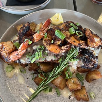 Station 6 - Blackened puppy drum topped with blackened shrimp over Brabant potatoes - Seafood Near Me - Bucktown, Louisiana Station 6 - Blackened puppy drum topped with blackened shrimp over Brabant potatoes - Seafood Near Me - Bucktown, Louisiana
