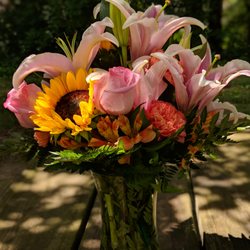 Sacred Botanical Design Studio - Beautiful, Bright, and Cheerful! Hugs of well wishes seem to flow from each flower! Blessed by the givers and floral designer.