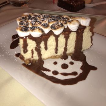 Village Green Restaurant - Almond crusted cheesecake topped with marshmallow and chocolate sauce so good! - French Near Me - Ridgewood, New Jersey Village Green Restaurant - Almond crusted cheesecake topped with marshmallow and chocolate sauce so good! - French Near Me - Ridgewood, New Jersey