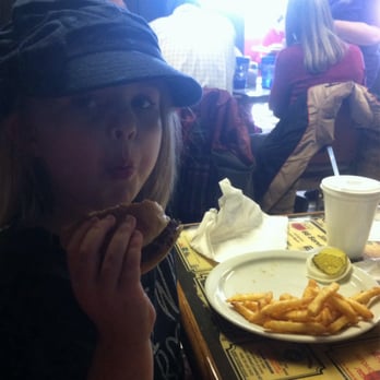 Stacy's - Enjoying her hamburger and fries. - Bakeries Near Me - Junction City, Kansas
