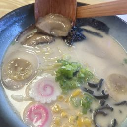 Tonkatsu ramen with pork chatsu and an extra soy marinated egg half. Delicious. Tonkatsu ramen with pork chatsu and an extra soy marinated egg half. Delicious.