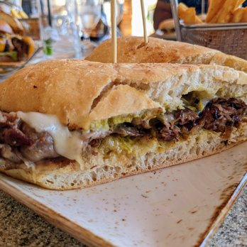NINETEEN at TPC Sawgrass - Roast Beef. $18. Onion jam, poblano aioli, Provolone, ciabatta, French fries. Nineteen restaurant at TPC Sawgrass. - American Near Me - Ponte Vedra Beach, Florida