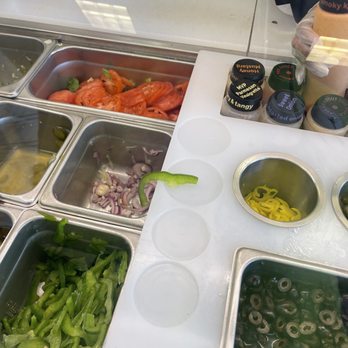 Subway - a variety of food items on a counter - Sandwiches Near Me - Macon, Georgia